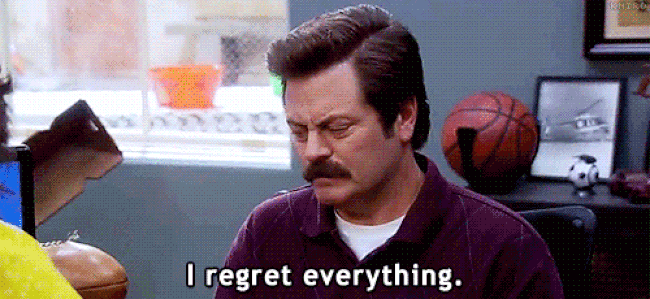A mustachioed-man stating he regrets everything. He looks very serious.
